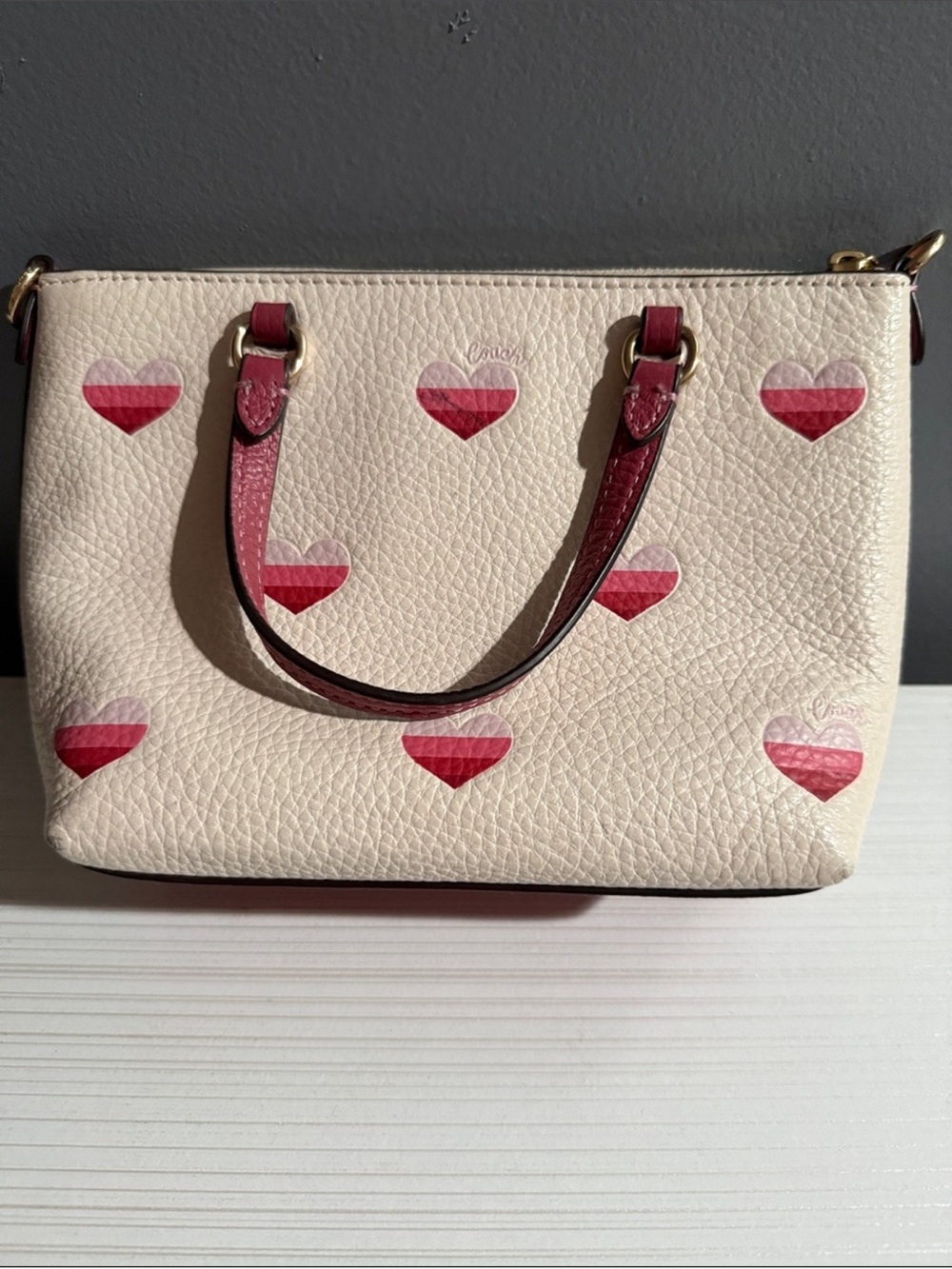 Coach Mini Gallery Crossbody Bag in white with a stripe heart print. - Picture 2 of 11
